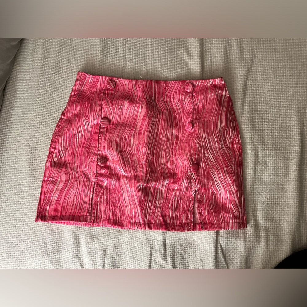 pink marble/zebra patterned skirt with faux buttons. Only worn once